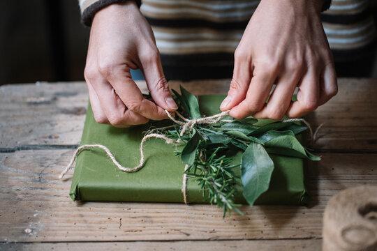 Woman's hands wrapping present