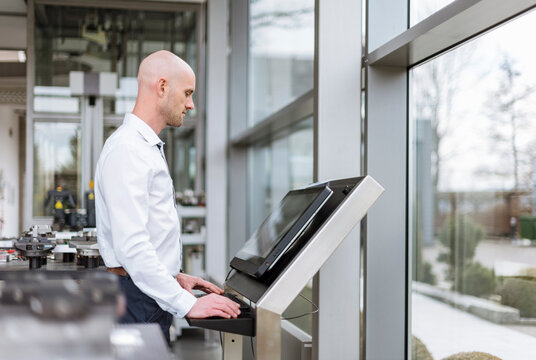 Businessman using computer in company