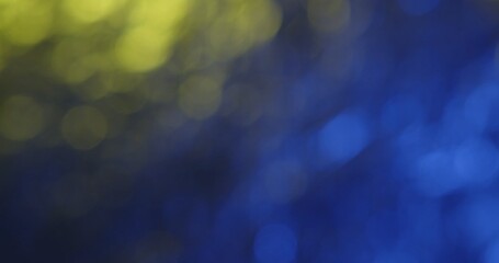 Abstract blurred fractured background featuring vibrant yellow and blue hues, creating a dreamy and soothing visual effect.