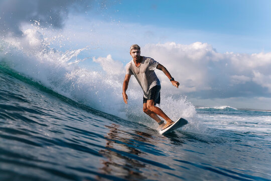 Surfer on a wave, Bali, Indonesia