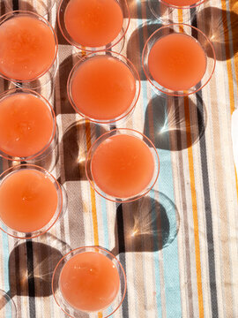 Cluster of drinks on striped tablecloth