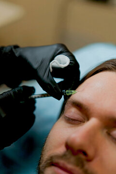 Botox injection into a man's face