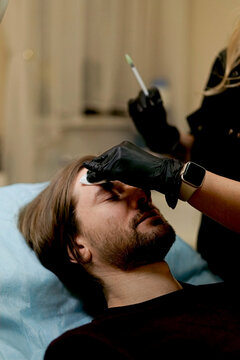 Botox injection into a man's face