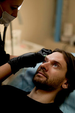 Botox injection into a man's face