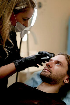 Botox injection into a man's face
