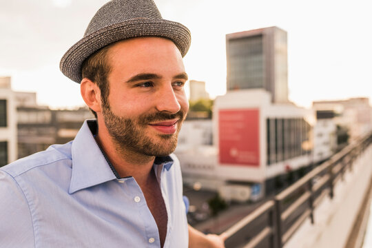 Portrait of smiling young man on rooftop