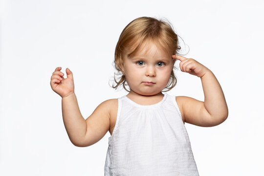 Portrait of blond girl tapping one's forehead, white background