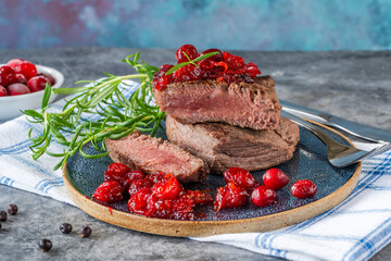 Roasted ostrich loin with cranberry and orange sauce