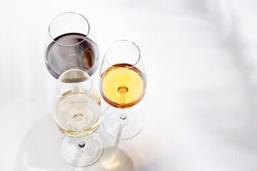 Obraz premium Different wine glasses on white background