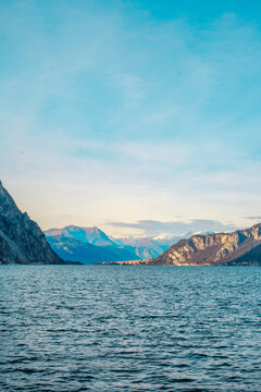 Evening view from Lecco over Lake Como with mountains before sunset