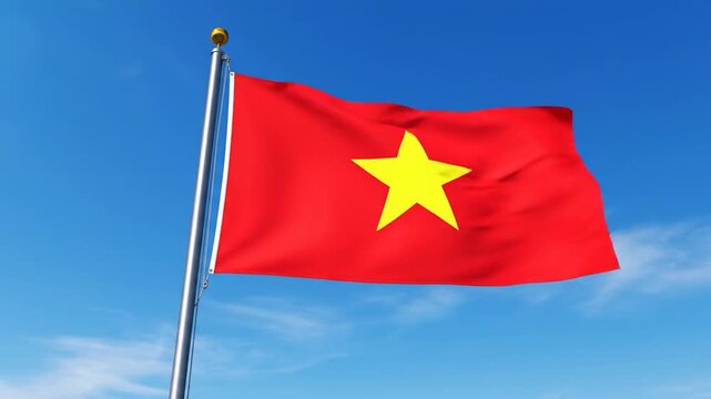A Vietnamese flag, red with a yellow star, waves against a clear blue sky