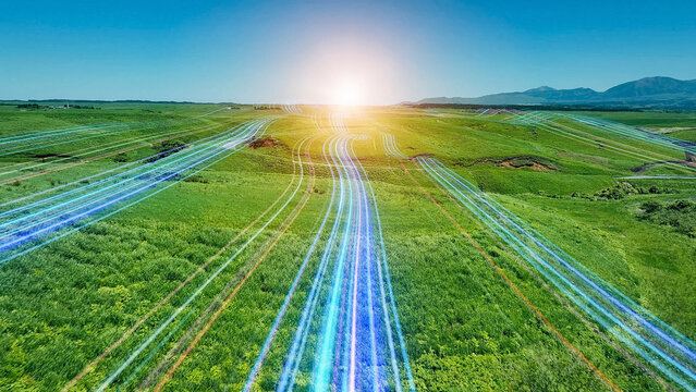 A band of light running through the grassland - a road leading to the future