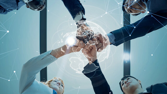 Multinational business people forming a circle and a global network