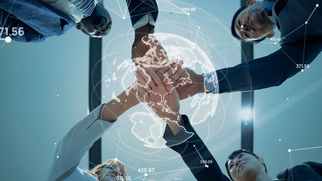 Multinational business people forming a circle and a global network