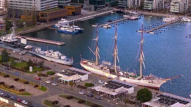 Aerial view showing the orp blyskawica destroyer museum ship and the dar pomorza tall ship moored in the gdynia marina, poland