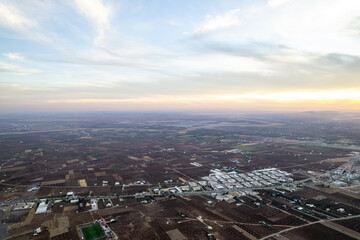 Obraz premium Aerial Panorama of Kilis Small Industrial Site and City Center Nestled Amongst Vast Agricultural Lands and Olive Groves