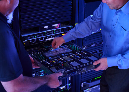 Two men working in data center