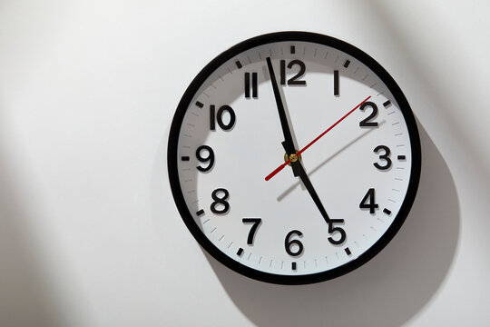 Wall clock on light streaked background