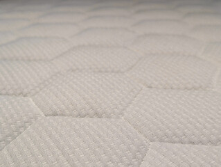 Naklejka premium White orthopedic mattress texture with a honeycomb quilted pattern