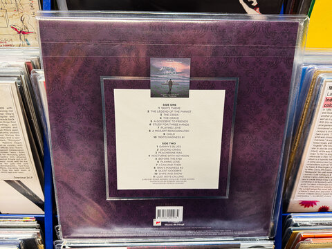 Back cover of a purple vinyl record with ornate pattern and tracklist visible. Ennio Morricone The Legend Of 1900.