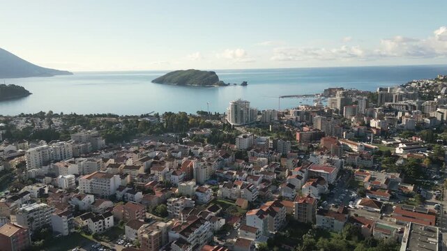 Panoramic view of Budva, a large coastal city in Crna Gora. Descending drone video.