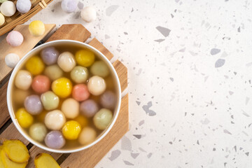 Colorful sweet glutinous rice balls tangyuan in sweet ginger syrup soup