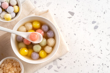 Colorful sweet glutinous rice balls tangyuan in sweet ginger syrup soup