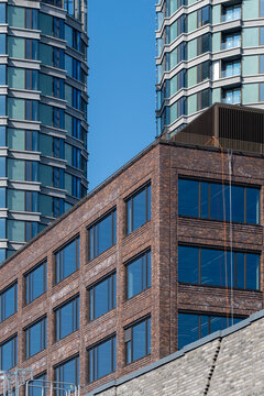 Modern urban architecture towers with brick glass skyline contrast in Stockholm Sweden capturing highrise lines and reflective windows
