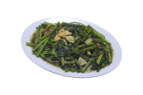 Stir Fried Water Spinach With Garlic And Chicken On White Plate