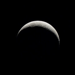 Thin Crescent Moon with Delicate Illumination and Lunar Relief