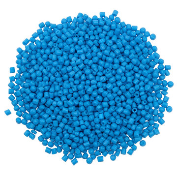 Pile of bright blue plastic pellets used in manufacturing processes