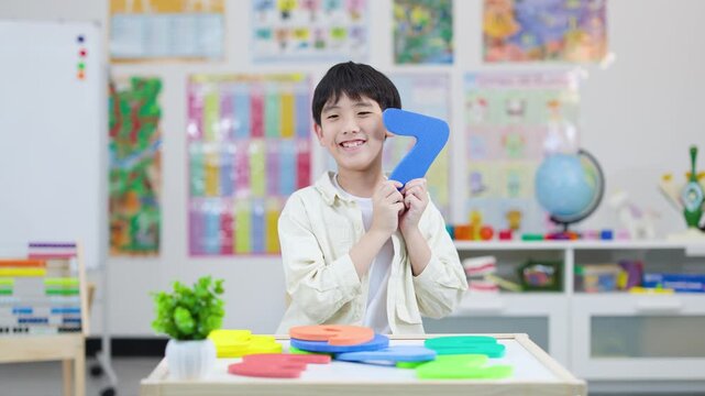 Smiling Child Learning Number Seven in Colorful Classroom