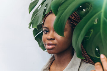 Portrait of a young African American woman among lush greenery