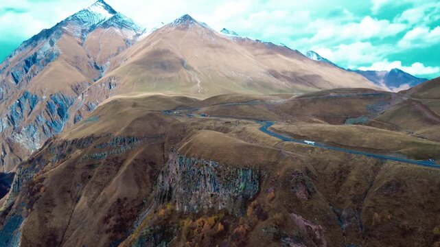 Georgian military road trip tourism in Caucasus alps and cliffs sout ossetia Alania border scenic