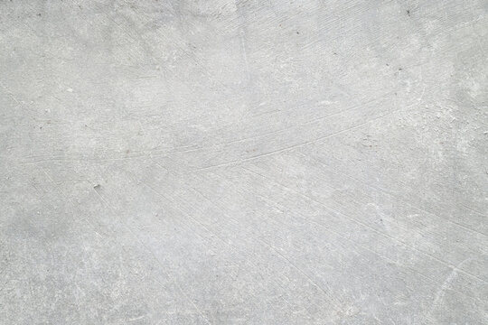 Textured grey concrete surface in frame, ideal for backgrounds in architecture, construction, urban design, and industrial projects.