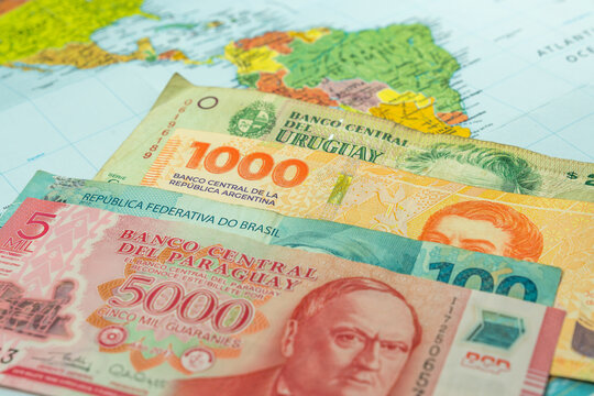 Mercosur South American trade union conept, world map with Brazilian, Argentine, Uruguayan and Paraguayan banknotes