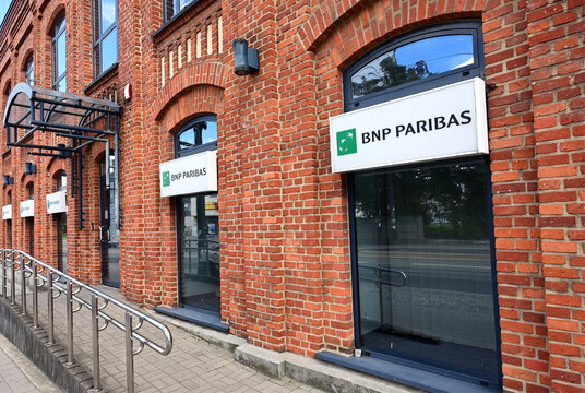 Ł&oacute;dź, Poland, Europe - 08.17.2025 : BNP PARIBAS logo on branch office at Rzgowska street, renovated historic building of former Cotton Factory of Stolarow Brothers from 19th century, Rzgowska street