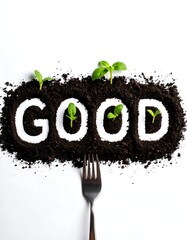 The Word Good Spelled Out in Soil with Seedlings and a Fork.