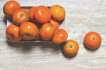 tangerine on wooden table, fruit