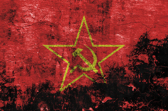 flag of the Soviet Union are painted on an old stone wall