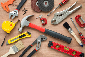 Flat lay of vary many set of hardware tools equipment, home DIY, fix repair, building construction, garage, carpenter, technician on wooden board background. Tools shop, hardware house, DIY concept.