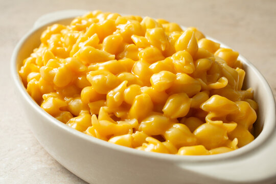 A closeup view of a bowl of dairy-free, gluten-free shell mac n cheese.