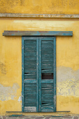 Fototapeta premium Old windows of a country house of Oltrepo Pavese, hilly area of Northern Italy (Lombardy Region, Pavia Province) famous for red, white and sparkling wine production.