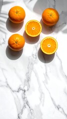 Vibrant Oranges on Marble - A Fresh and Healthy Still Life.