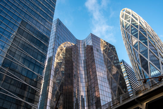 Modern district architecture skyscraper for corporate business finance office towers in Paris La Defense France showing height geometry and clean glass design