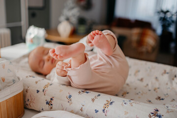 Baby lying down on changing table