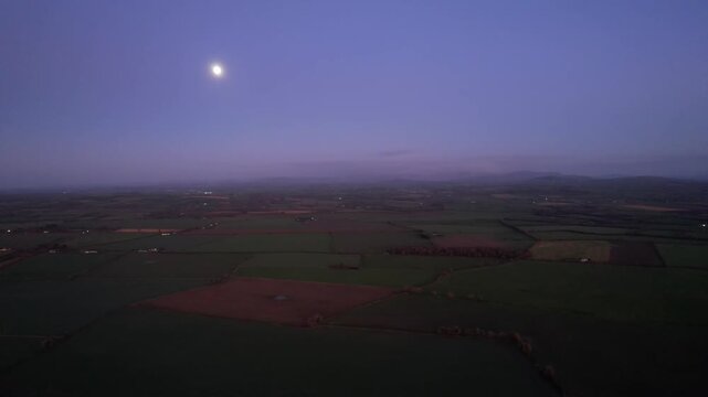 A cold winter night in Kildare Ireland lights of farmsteads in a rural location