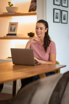 Woma using her laptop computer and working from home
