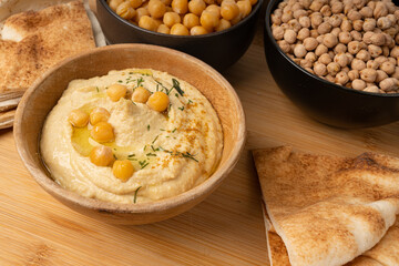 Hummus in bowl, houmous dip, chickpea humus tahini sauce, middle eastern spread