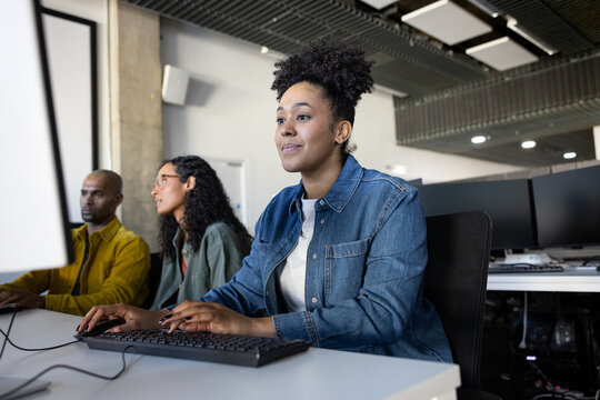 Focused businesswoman working at her desk in a modern workspace